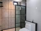 Modern bathroom with glass shower and elegant tiling