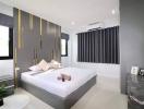 Modern bedroom with stylish interior design and queen-sized bed