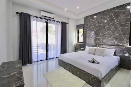Modern bedroom with double bed and elegant interior design