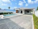 Modern house with a pool and spacious driveway