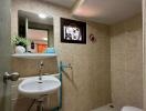 Well-maintained bathroom with tiled walls, mirror, and essential fixtures