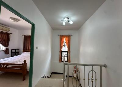 Cozy bedroom with an en-suite bathroom and natural lighting