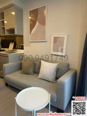 Compact living room interior with a couch and a round table