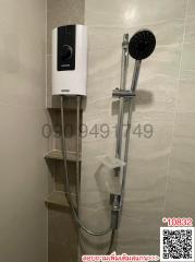 Modern bathroom with wall-mounted water heater and handheld showerhead