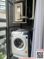 Modern laundry appliances on the balcony with urban surroundings