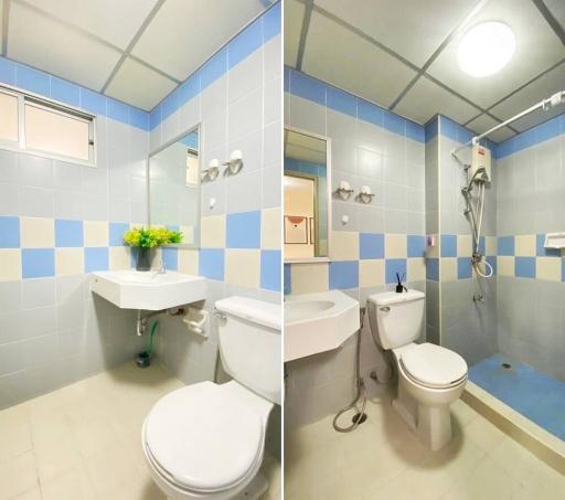 Brightly lit bathroom with blue and white tiles, including modern fixtures and fittings