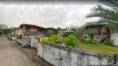 Suburban house exterior with garden and fence