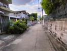 Quiet residential street with sidewalks and surrounding houses