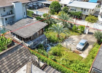 Aerial view of a residential property with a house and garden