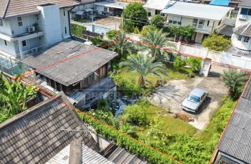 Aerial view of a residential property with a house and garden