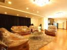 Spacious living room with modern furnishings and ample lighting