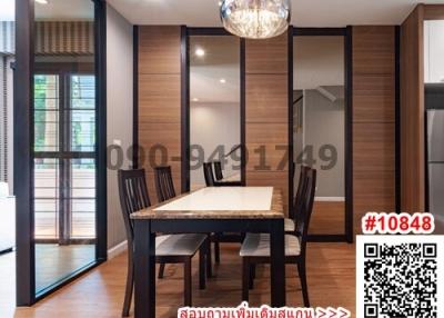 Modern dining room with table set and open sliding doors