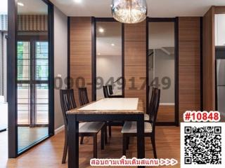 Modern dining room with table set and open sliding doors