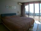 Bedroom with ocean view and balcony access