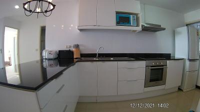 Modern kitchen with stainless steel appliances and white cabinetry