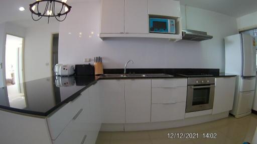 Modern kitchen with stainless steel appliances and white cabinetry