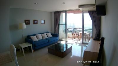 Modern living room with balcony access and ample natural light