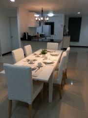 Modern dining area with stylish table setting and open concept layout