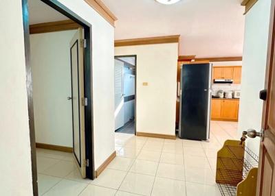 Compact kitchen with modern appliances and tiled flooring