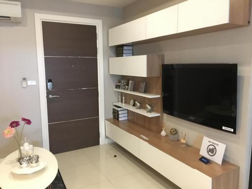 Modern living room interior with television and decorative shelving