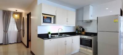 Modern kitchen with stainless steel appliances and white cabinetry