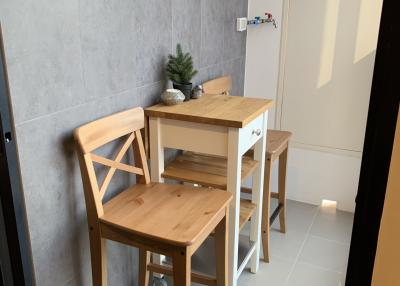 Compact dining space with minimalist wooden table and chairs