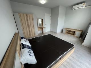Spacious bedroom with modern design and air conditioning