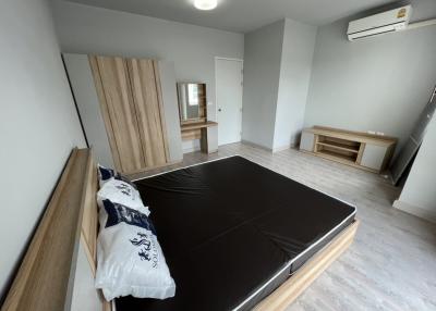 Spacious bedroom with modern design and air conditioning