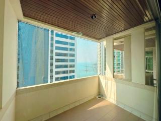 Sunny balcony with ocean view and modern window shades