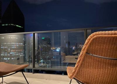 Balcony with a view of the city skyline at night