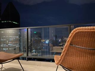 Balcony with a view of the city skyline at night