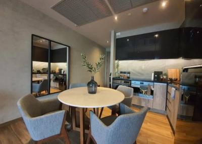 Modern kitchen with adjacent dining area in an open-plan living space