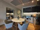 Modern kitchen with adjacent dining area in an open-plan living space