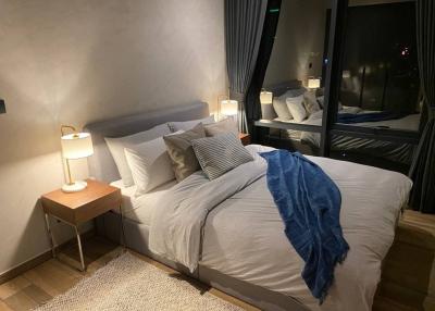 Cozy modern bedroom at night with ambient lighting