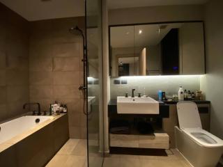 Modern bathroom interior with walk-in shower and bathtub