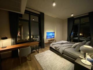 Cozy modern bedroom with large bed and ambient lighting