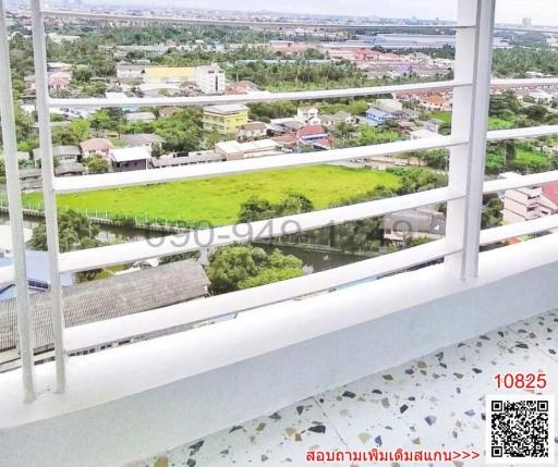 High-rise balcony view of urban landscape and greenery