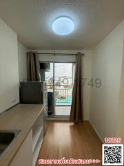 Cozy bedroom with natural light and balcony access