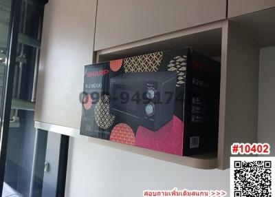Microwave oven in kitchen shelf