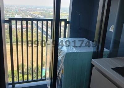 Balcony with city view and air conditioning unit