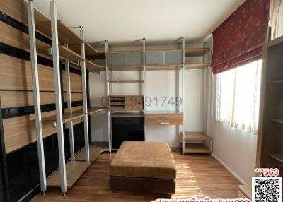 Modern bedroom with large bed and built-in shelves