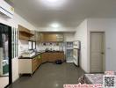 Spacious kitchen with modern appliances and ample cabinetry