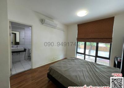 Spacious bedroom with en-suite bathroom and air conditioning