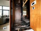 Modern entryway with wooden panel walls and marble flooring