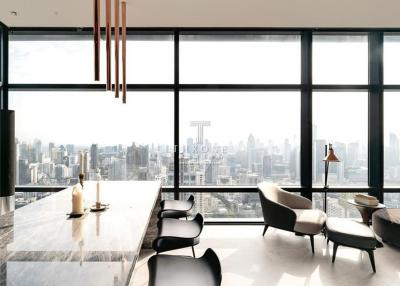 Modern living room with large windows offering a panoramic city view