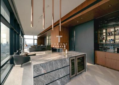 Modern living room with kitchen bar and cityscape view