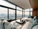 Modern living room with large windows offering a panoramic city view