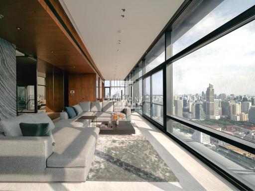 Modern living room with large windows and city view