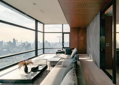 Modern living room with panoramic city view through floor-to-ceiling windows