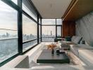 Modern living room with large windows and cityscape view